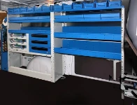 Lo scaffale a sinistra del Vito visto dalla porta laterale